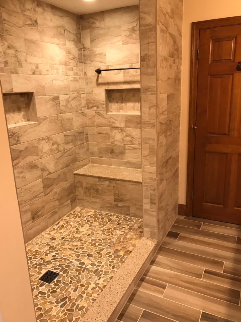 Auburn, NH custom tiled shower with built in bench