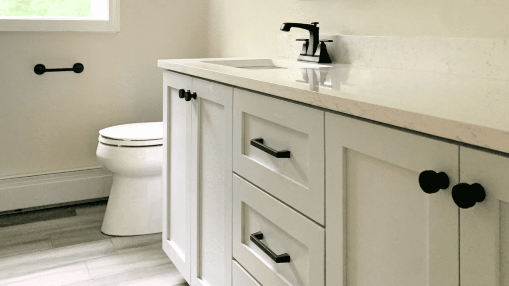 Cream bathroom vanity with black hardware